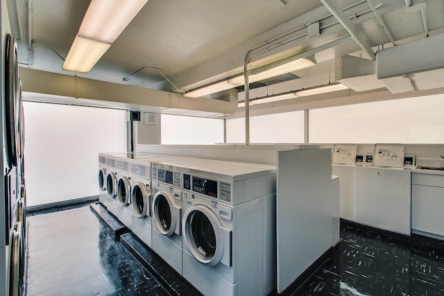 shared laundry room with washer and clothes dryer