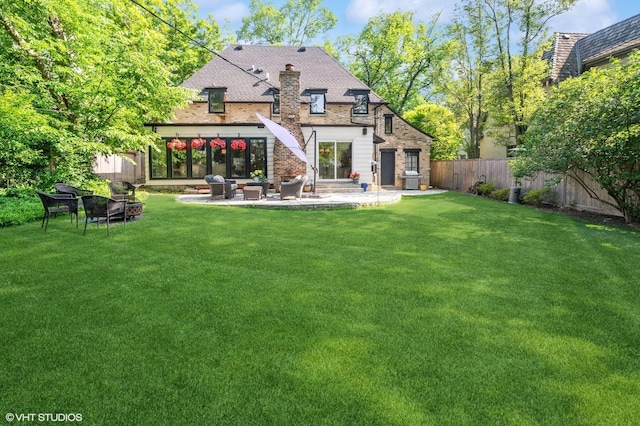 505 Jackson Ave, Glencoe, IL 60022 - rear view of house with a patio area and a chimney