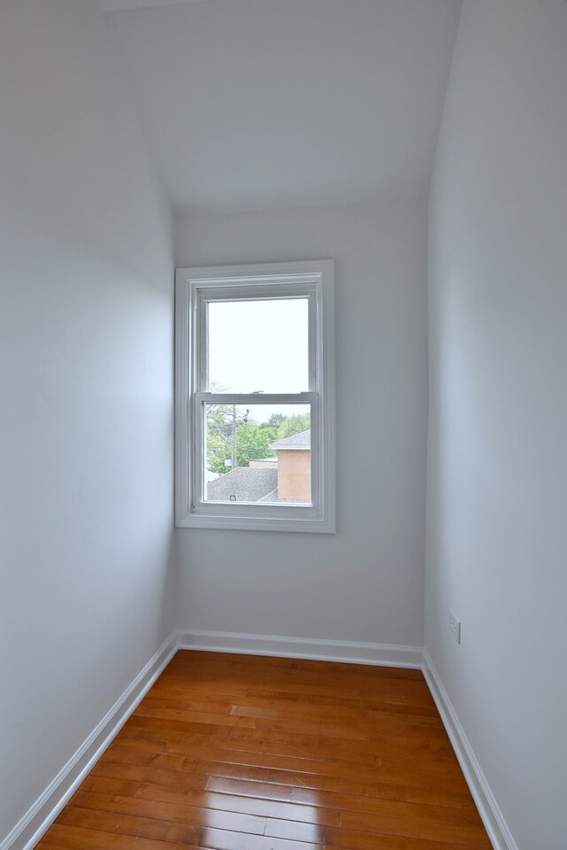 5104 N Austin Ave, Chicago, IL 60630 - empty room featuring wood-type flooring and baseboards