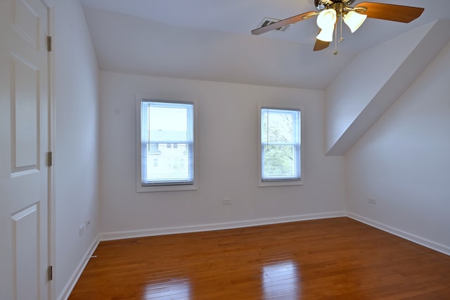 5104 N Austin Ave, Chicago, IL 60630 - bonus room featuring plenty of natural light, wood-type flooring, vaulted ceiling, a ceiling fan, and baseboards