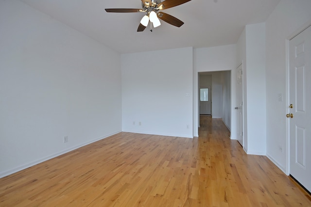 5104 N Austin Ave, Chicago, IL 60630 - spare room featuring light wood-type flooring, ceiling fan, and baseboards