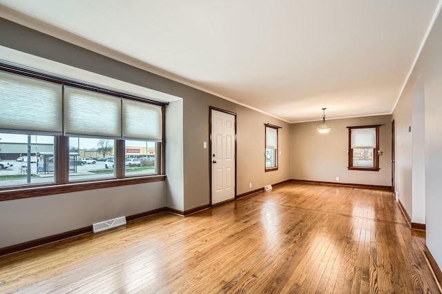 3254 W 115th St, Chicago, IL 60655 - spare room featuring light wood finished floors, crown molding, and baseboards