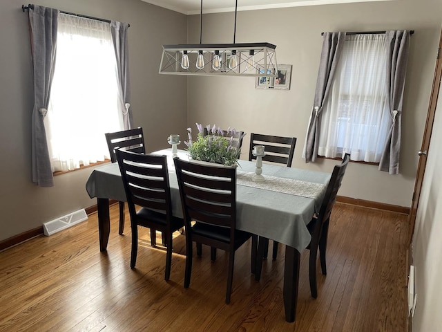 3254 W 115th St, Chicago, IL 60655 - dining area featuring ornamental molding, baseboards, and hardwood / wood-style flooring