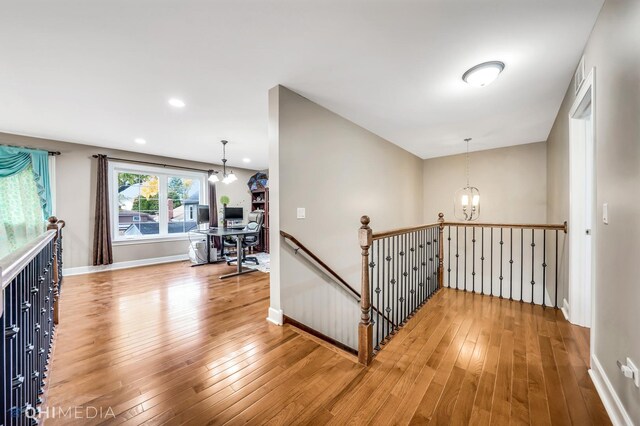 1327 Greenwood Ave, Deerfield, IL 60015 - hallway featuring an upstairs landing, a chandelier, light wood finished floors, an office area, and baseboards