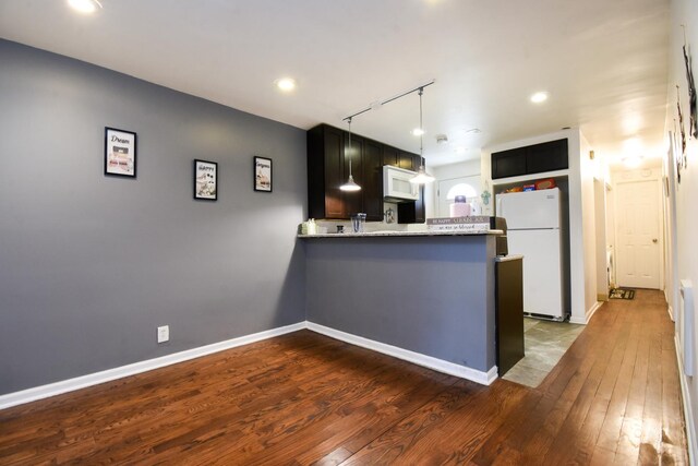 523 E 41st St, Chicago, IL 60653 - kitchen with white appliances, dark wood-type flooring, a peninsula, track lighting, and recessed lighting