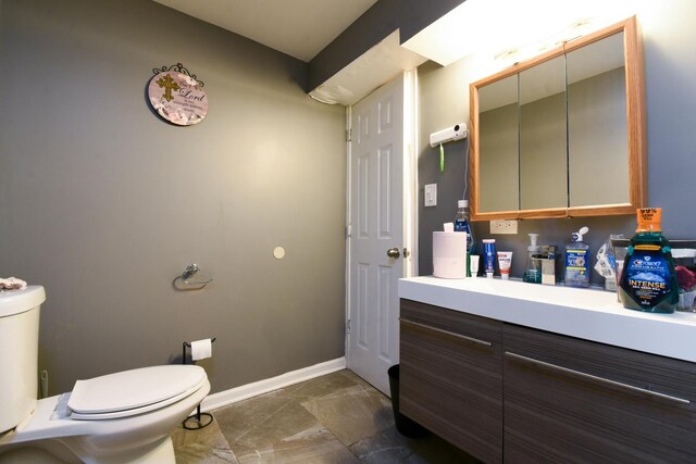 523 E 41st St, Chicago, IL 60653 - bathroom with toilet, vanity, and baseboards