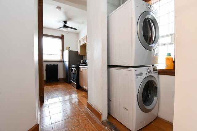 523 E 41st St, Chicago, IL 60653 - washroom featuring stacked washer / dryer, ceiling fan, and baseboards
