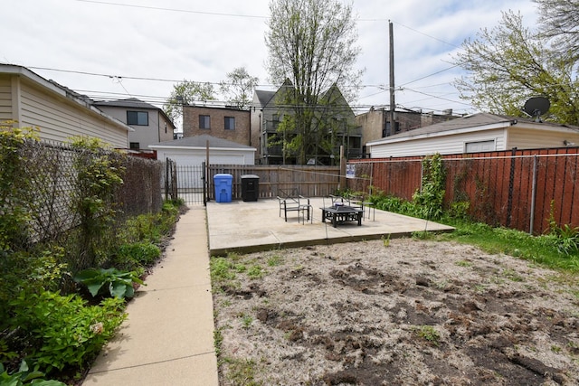 523 E 41st St, Chicago, IL 60653 - fenced backyard with a fire pit and a patio area