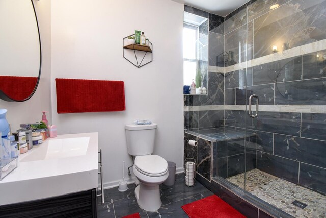 523 E 41st St, Chicago, IL 60653 - bathroom with vanity, toilet, a shower stall, and baseboards