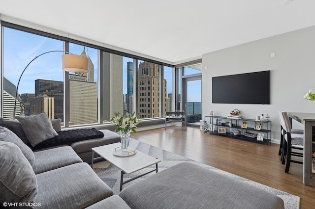 60 E Monroe St Unit 3308, Chicago, IL 60603 - living room with wood finished floors, healthy amount of natural light, a view of city, and a wall of windows