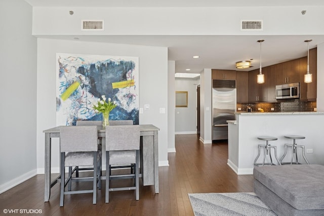 60 E Monroe St Unit 3308, Chicago, IL 60603 - dining area with dark wood-style floors, baseboards, and recessed lighting