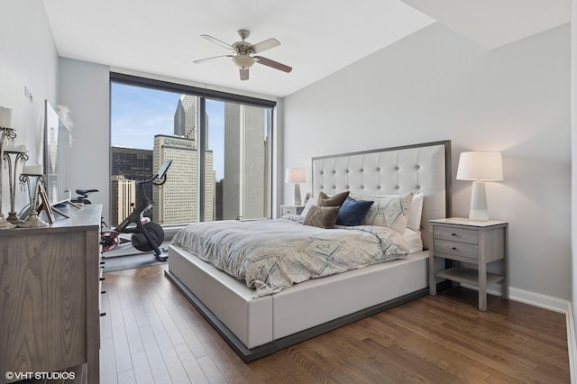 60 E Monroe St Unit 3308, Chicago, IL 60603 - bedroom with dark wood finished floors, floor to ceiling windows, a ceiling fan, and baseboards