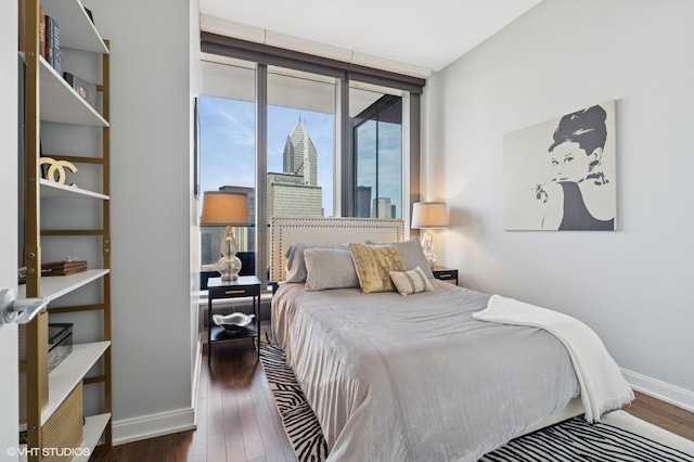 60 E Monroe St Unit 3308, Chicago, IL 60603 - bedroom with baseboards and wood finished floors