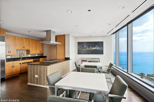60 E Monroe St Unit 3308, Chicago, IL 60603 - kitchen featuring island range hood, dark countertops, stainless steel appliances, healthy amount of natural light, and recessed lighting