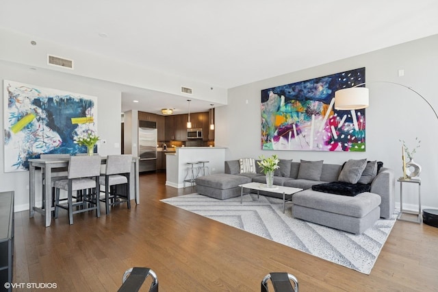 60 E Monroe St Unit 3308, Chicago, IL 60603 - living room with dark wood finished floors and baseboards