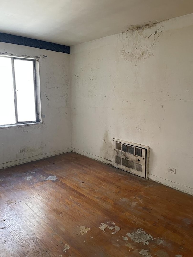empty room with wood-type flooring