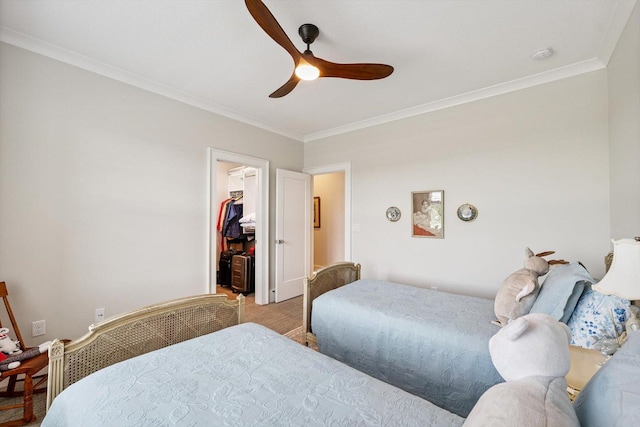 604 Cayman Way, Savoy, IL 61874 - bedroom featuring ornamental molding, a spacious closet, ceiling fan, a closet, and carpet floors