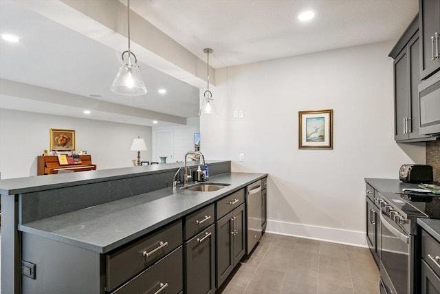 604 Cayman Way, Savoy, IL 61874 - kitchen featuring a peninsula, stainless steel appliances, dark countertops, recessed lighting, and decorative light fixtures