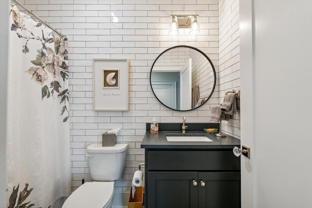 604 Cayman Way, Savoy, IL 61874 - bathroom with tile walls, vanity, and a shower with curtain