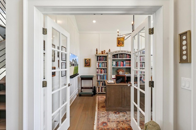 604 Cayman Way, Savoy, IL 61874 - home office featuring french doors, a chandelier, and wood finished floors