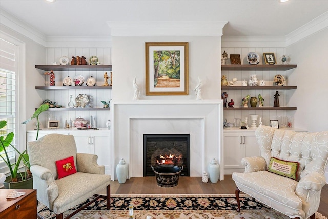 604 Cayman Way, Savoy, IL 61874 - living area with crown molding, wood finished floors, and a glass covered fireplace