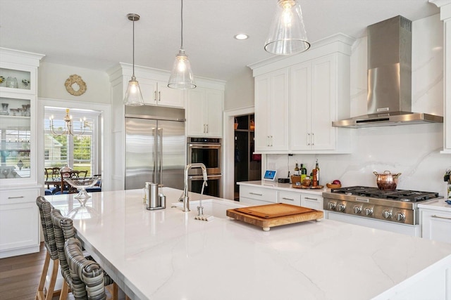 604 Cayman Way, Savoy, IL 61874 - kitchen featuring wall chimney range hood, stainless steel appliances, white cabinets, and recessed lighting
