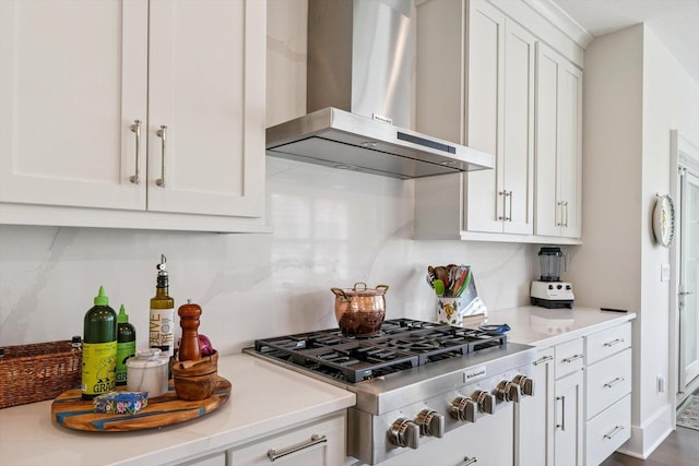 604 Cayman Way, Savoy, IL 61874 - kitchen with wall chimney range hood, stainless steel gas cooktop, white cabinets, and light countertops