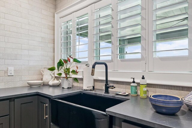 604 Cayman Way, Savoy, IL 61874 - kitchen with healthy amount of natural light and decorative backsplash