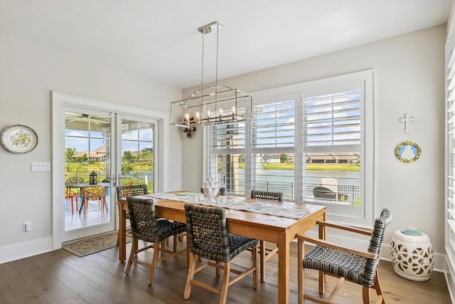 604 Cayman Way, Savoy, IL 61874 - dining room featuring a chandelier and wood finished floors