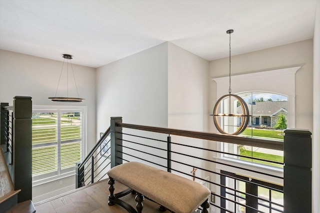 604 Cayman Way, Savoy, IL 61874 - hall with an upstairs landing, wood finished floors, and a chandelier
