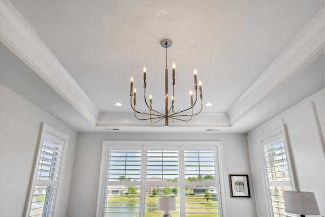 604 Cayman Way, Savoy, IL 61874 - detailed view of a chandelier, a tray ceiling, and nearby water