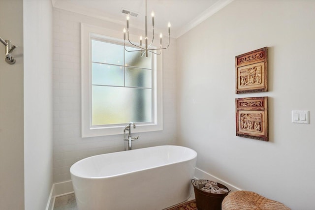 604 Cayman Way, Savoy, IL 61874 - full bathroom with a chandelier, a freestanding bath, plenty of natural light, and crown molding