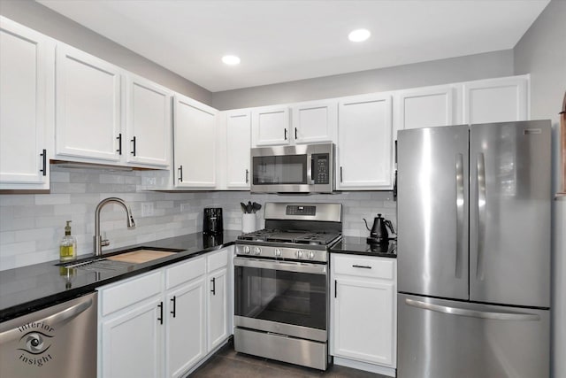 1525 Raymond Dr Unit 103, Naperville, IL 60563 - kitchen with stainless steel appliances, a sink, dark countertops, white cabinets, and recessed lighting