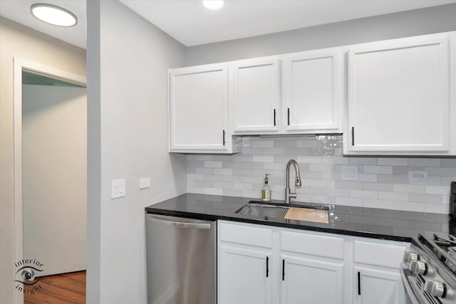 1525 Raymond Dr Unit 103, Naperville, IL 60563 - kitchen with stainless steel appliances, a sink, white cabinetry, and tasteful backsplash