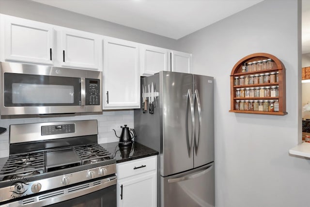 1525 Raymond Dr Unit 103, Naperville, IL 60563 - kitchen with stainless steel appliances, white cabinets, tasteful backsplash, and dark stone countertops