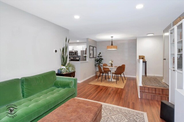 1525 Raymond Dr Unit 103, Naperville, IL 60563 - living area with wood finished floors, baseboards, and recessed lighting