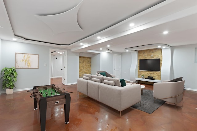 game room with finished concrete flooring, recessed lighting, and baseboards