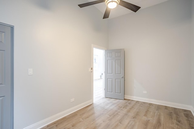 1013 W 18th Pl, Chicago, IL 60608 - unfurnished room with ceiling fan, light wood-type flooring, baseboards, and a high ceiling