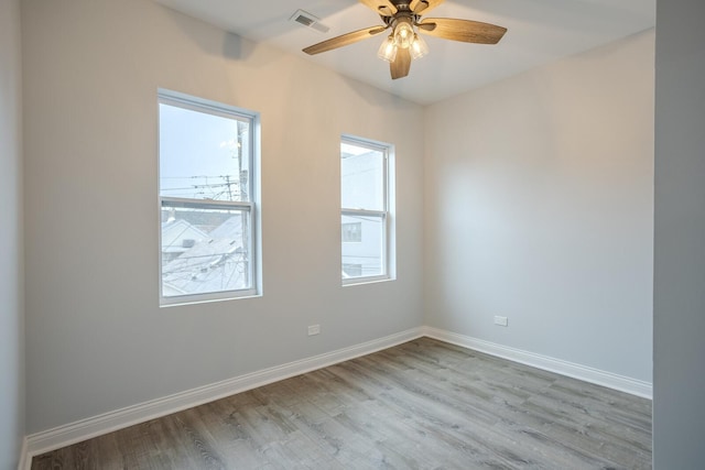 1013 W 18th Pl, Chicago, IL 60608 - spare room with wood finished floors, baseboards, and ceiling fan