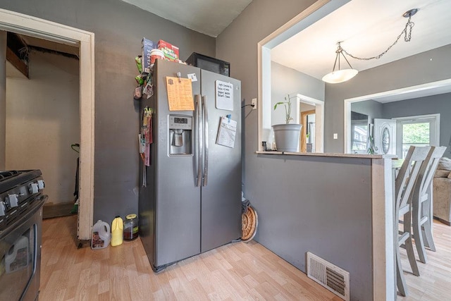 14922 Lawndale Ave, Midlothian, IL 60445 - kitchen with stainless steel fridge with ice dispenser, gas range, and light wood-type flooring