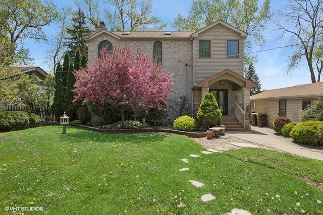 view of front of home featuring a front lawn and a chimney