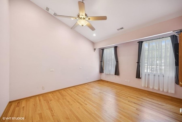 empty room featuring light wood-style flooring, vaulted ceiling, a ceiling fan, baseboards, and recessed lighting