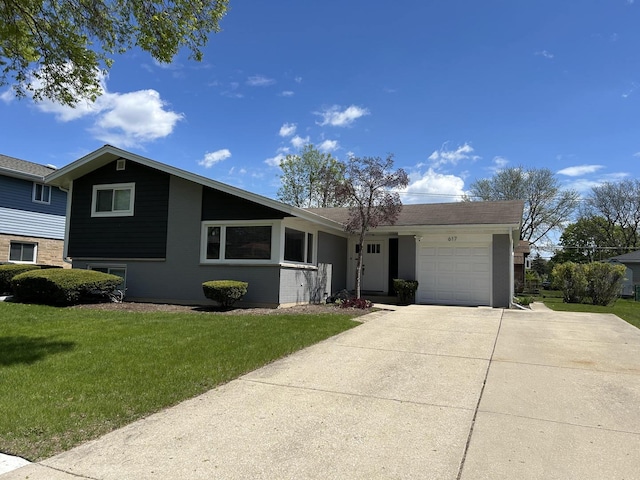 617 S Albert St, Mount Prospect, IL 60056 - view of front of house featuring a garage, concrete driveway, a front lawn, and brick siding