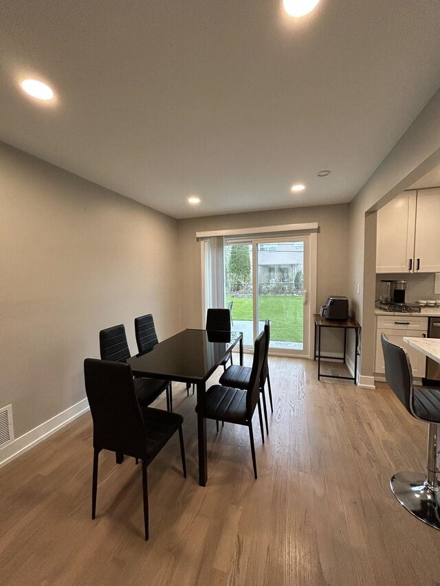 617 S Albert St, Mount Prospect, IL 60056 - dining space featuring light wood-style floors, baseboards, and recessed lighting