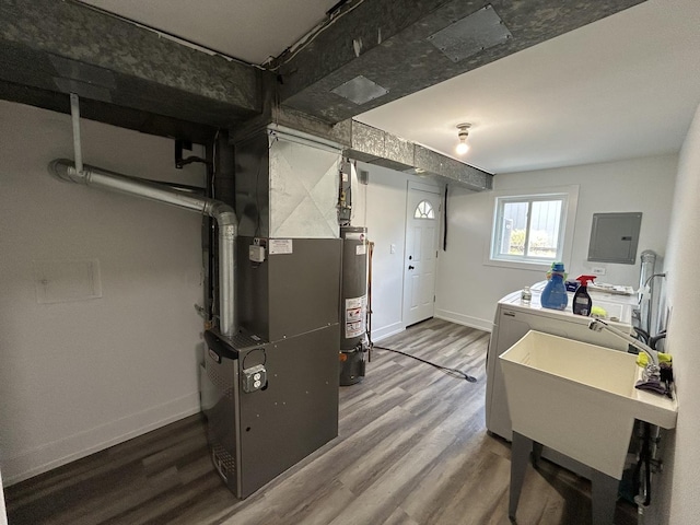 617 S Albert St, Mount Prospect, IL 60056 - utility room with washing machine and dryer, water heater, electric panel, and heating unit