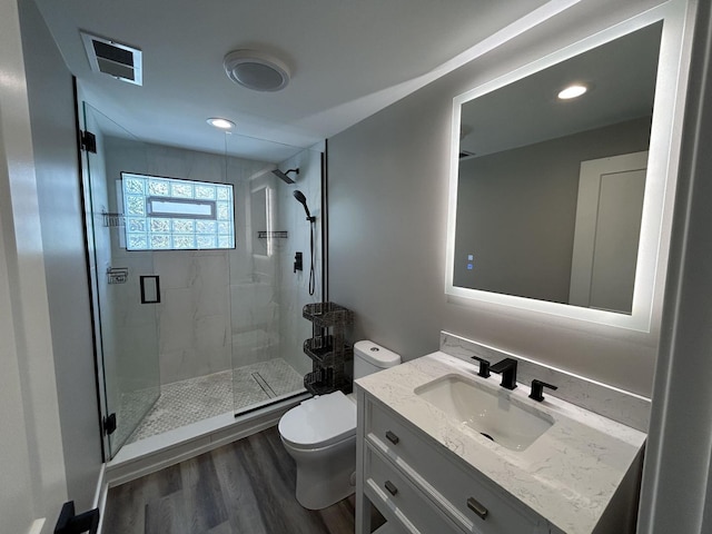 617 S Albert St, Mount Prospect, IL 60056 - full bath with a stall shower, toilet, wood finished floors, vanity, and recessed lighting