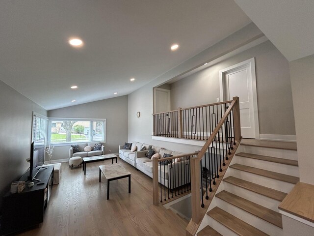 617 S Albert St, Mount Prospect, IL 60056 - living area featuring recessed lighting, wood finished floors, lofted ceiling, baseboards, and stairway
