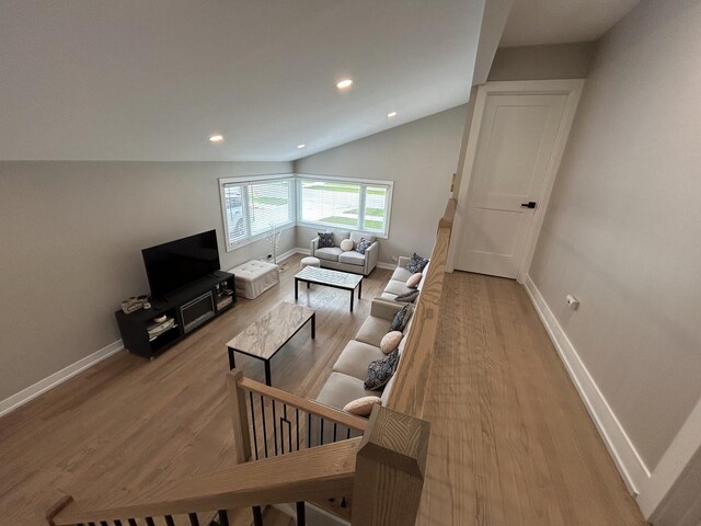 617 S Albert St, Mount Prospect, IL 60056 - living room featuring light wood-type flooring, baseboards, vaulted ceiling, and recessed lighting