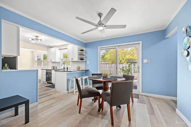 806 71st St, Darien, IL 60561 - dining space with light wood finished floors, a ceiling fan, ornamental molding, and baseboards