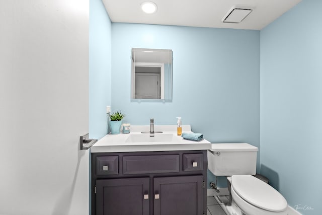 806 71st St, Darien, IL 60561 - bathroom with vanity, toilet, and tile patterned floors
